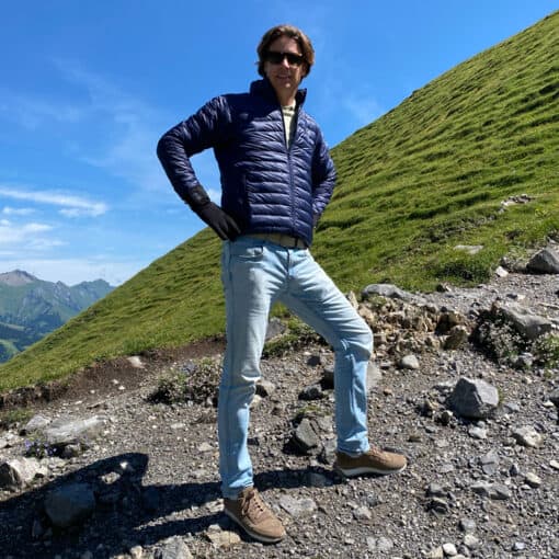 man with heated men's jacket in the mountains