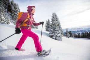 Woman in the snow with women's heated gloves